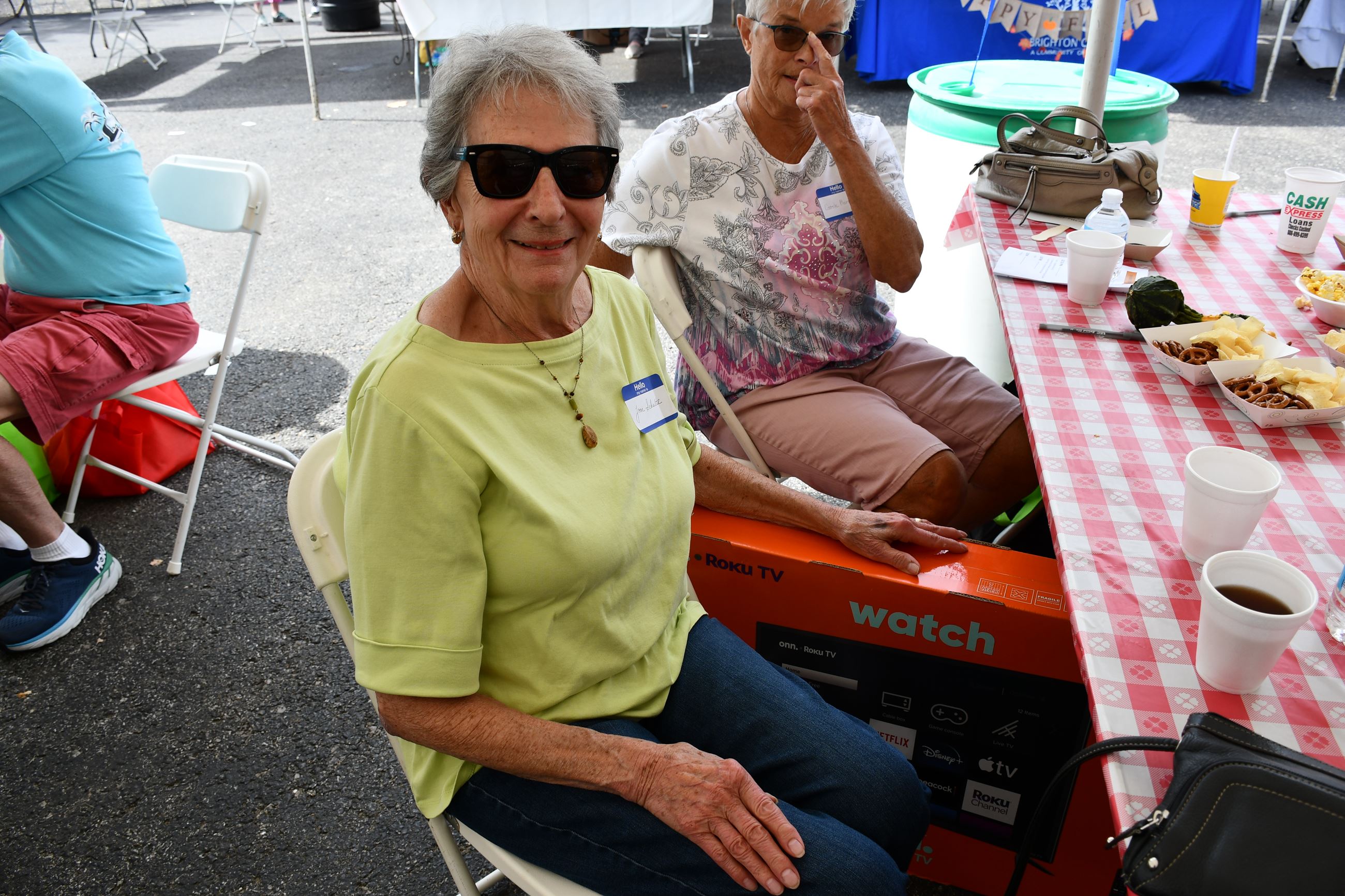 Attendee poses with door prize.